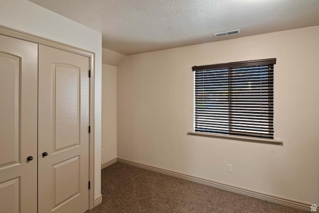 384 N 710 E, Salem, UT 84653 - unfurnished bedroom with carpet, a closet, a textured ceiling, and baseboards