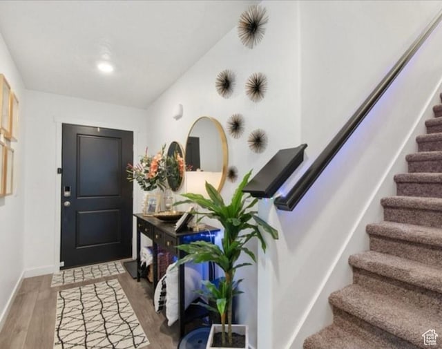 8578 W Bowie Dr, Magna, UT 84044 - entrance foyer with stairs, light wood-type flooring, and baseboards
