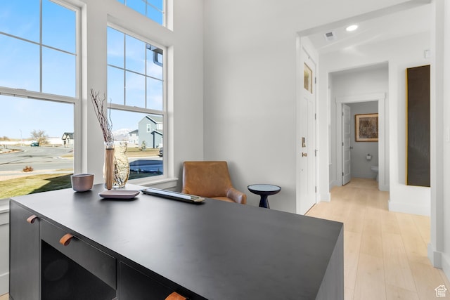 office featuring plenty of natural light, light wood-type flooring, recessed lighting, and baseboards