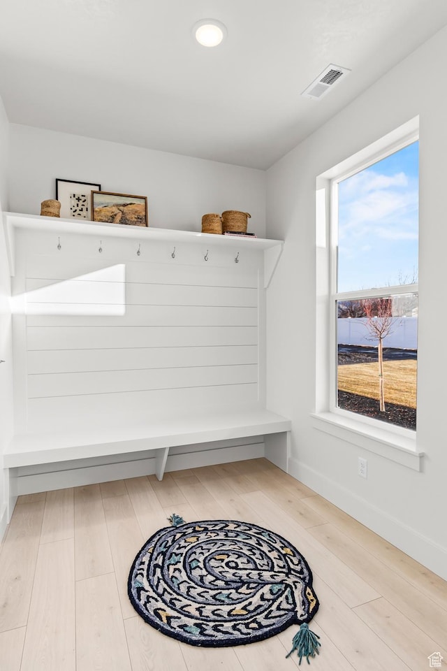 mudroom featuring wood finished floors and baseboards