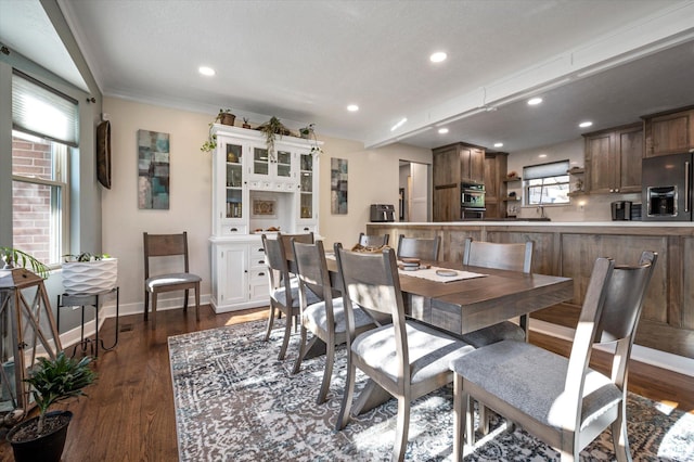 dining room featuring dark wood-style flooring, baseboards, recessed lighting, and ornamental molding