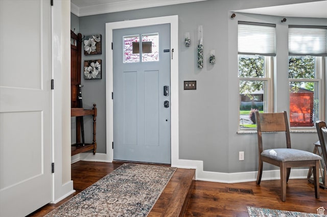 entryway with dark wood-style flooring, baseboards, and ornamental molding