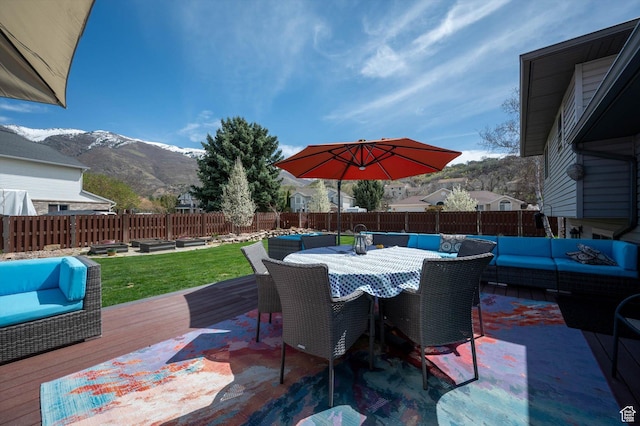 view of patio with an outdoor hangout area, a deck with mountain view, and outdoor dining area