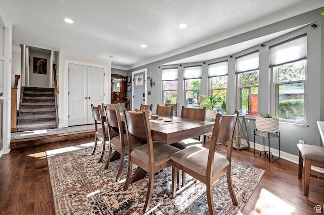 dining area featuring baseboards, ornamental molding, stairway, recessed lighting, and wood finished floors