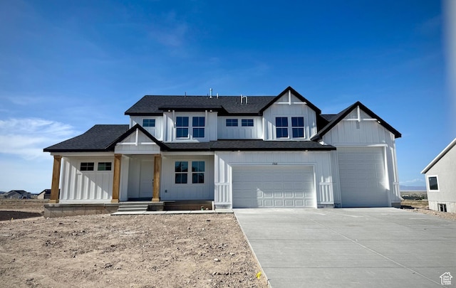 modern farmhouse with board and batten siding, driveway, a porch, and a shingled roof