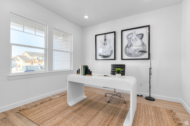 office space featuring wood finished floors, baseboards, healthy amount of natural light, and recessed lighting