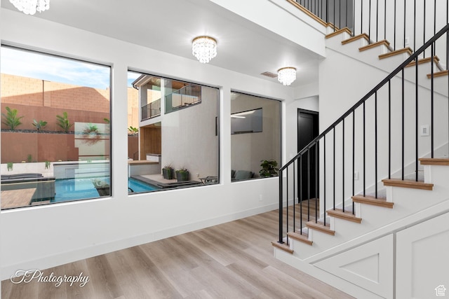 3195 S Tallow Tree Dr, St George, UT 84790 - entryway with wood finished floors, stairway, and a chandelier