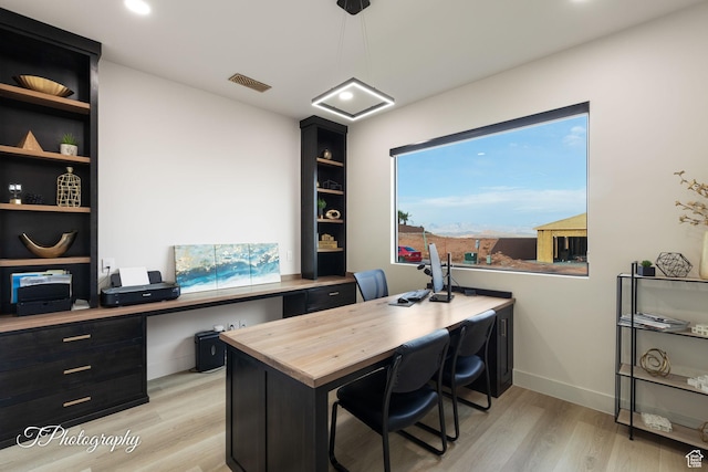 3195 S Tallow Tree Dr, St George, UT 84790 - office area with light wood finished floors, built in study area, and recessed lighting