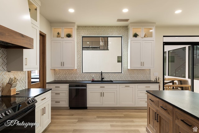3195 S Tallow Tree Dr, St George, UT 84790 - kitchen featuring dark countertops, black electric range, tasteful backsplash, light wood-type flooring, and recessed lighting