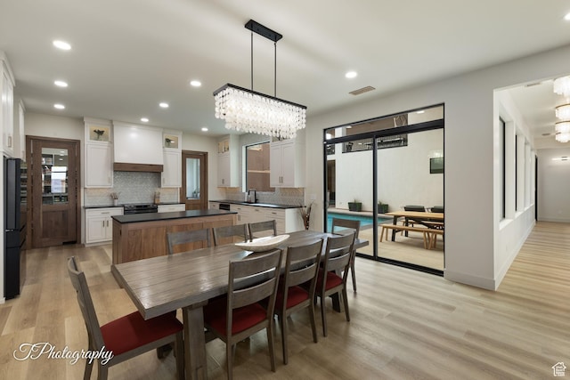 3195 S Tallow Tree Dr, St George, UT 84790 - dining space featuring a chandelier, light wood finished floors, and recessed lighting
