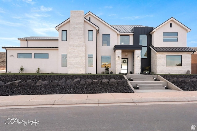 3195 S Tallow Tree Dr, St George, UT 84790 - view of front of house with a standing seam roof, stone siding, a metal roof, and stucco siding