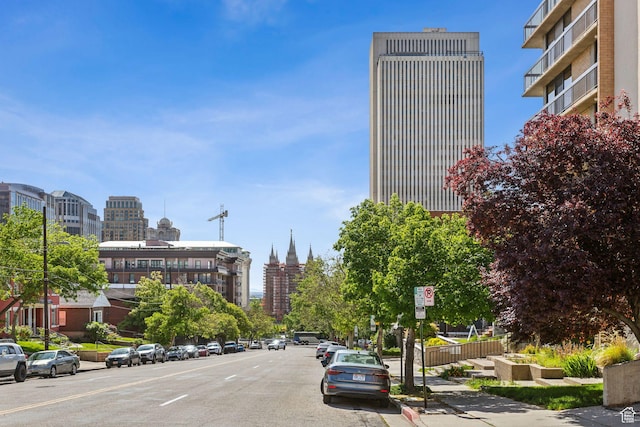 131 E 1st Ave N Unit 305, Salt Lake City, UT 84103 - view of asphalt street with sidewalks, a city view, curbs, and street lighting