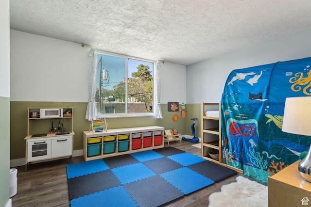 131 E 1st Ave N Unit 305, Salt Lake City, UT 84103 - recreation room featuring wood finished floors and a textured ceiling