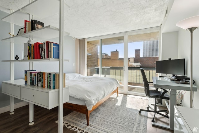 131 E 1st Ave N Unit 305, Salt Lake City, UT 84103 - bedroom featuring wood finished floors, access to exterior, a wall of windows, and an office area