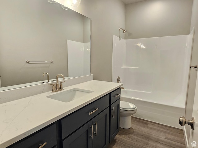 3782 S 4250 W Unit 432B, West Haven, UT 84401 - bathroom featuring wood finished floors, vanity, shower / washtub combination, and toilet