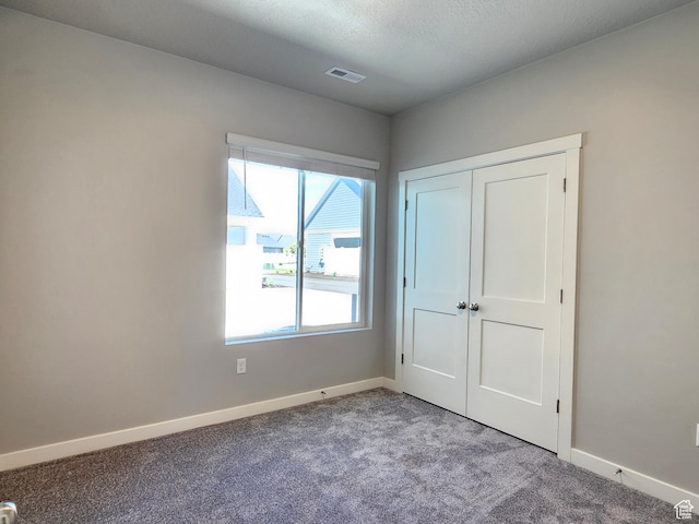 3782 S 4250 W Unit 432B, West Haven, UT 84401 - unfurnished bedroom featuring carpet flooring, baseboards, and a closet