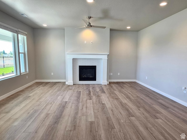 3782 S 4250 W Unit 432B, West Haven, UT 84401 - unfurnished living room with a ceiling fan, wood finished floors, recessed lighting, baseboards, and a textured ceiling