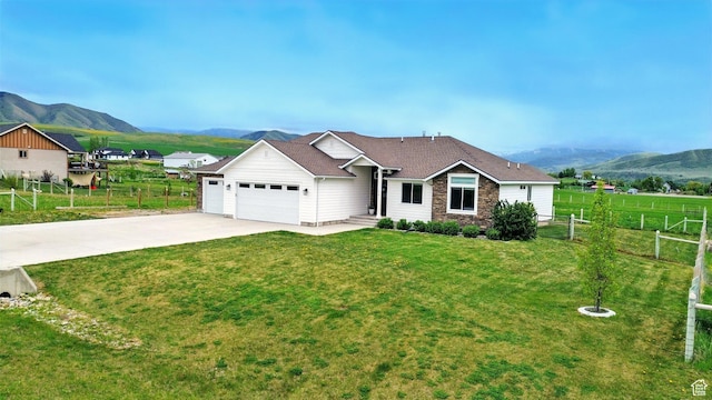 114 E 9500 S, Paradise, UT 84328 - ranch-style house featuring a mountain view, an attached garage, stone siding, and driveway