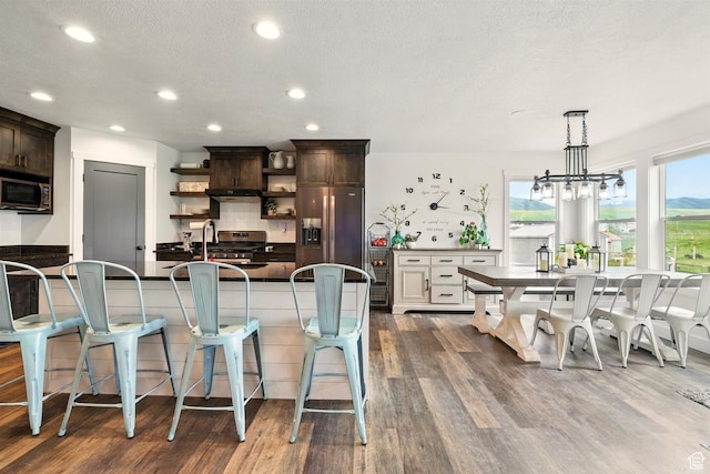 114 E 9500 S, Paradise, UT 84328 - kitchen featuring fridge with ice dispenser, open shelves, dark countertops, dark brown cabinets, and recessed lighting