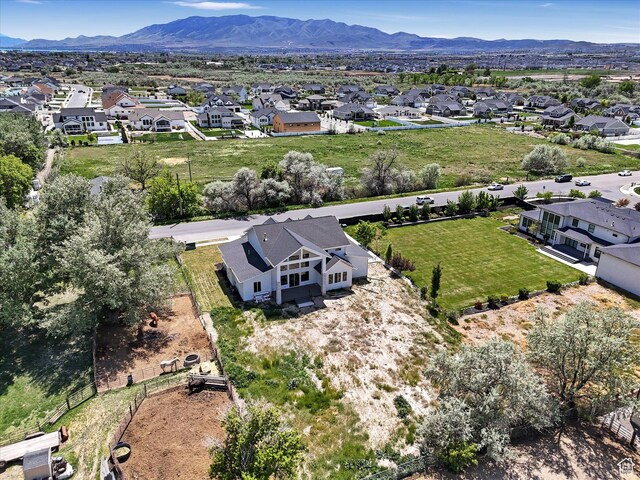 aerial view of residential area featuring a mountain backdrop