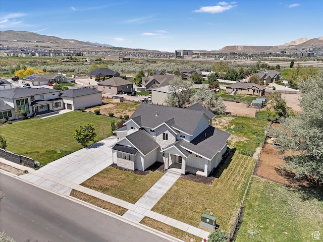 aerial perspective of suburban area featuring a mountain backdrop