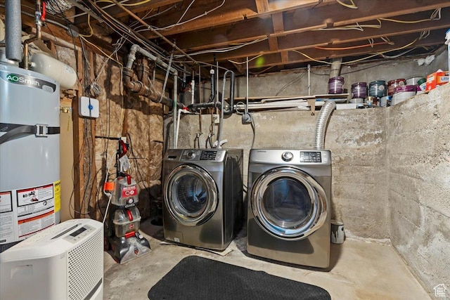 laundry area featuring secured water heater and washing machine and dryer