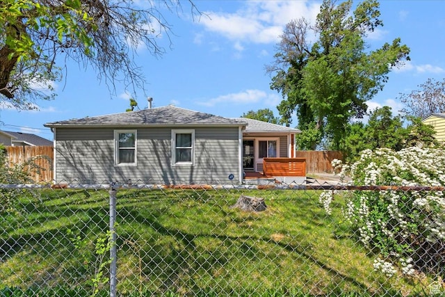 rear view of house featuring a jacuzzi