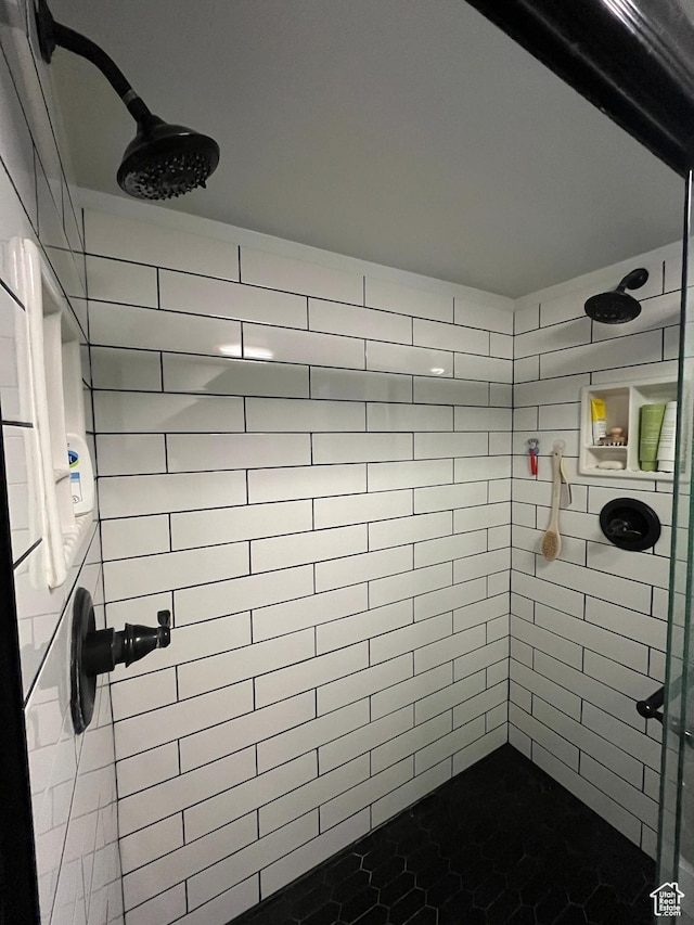 full bath featuring tiled shower