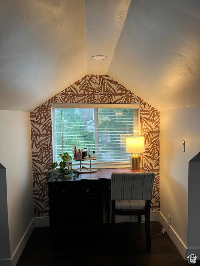 office with baseboards, wallpapered walls, lofted ceiling, and wood finished floors