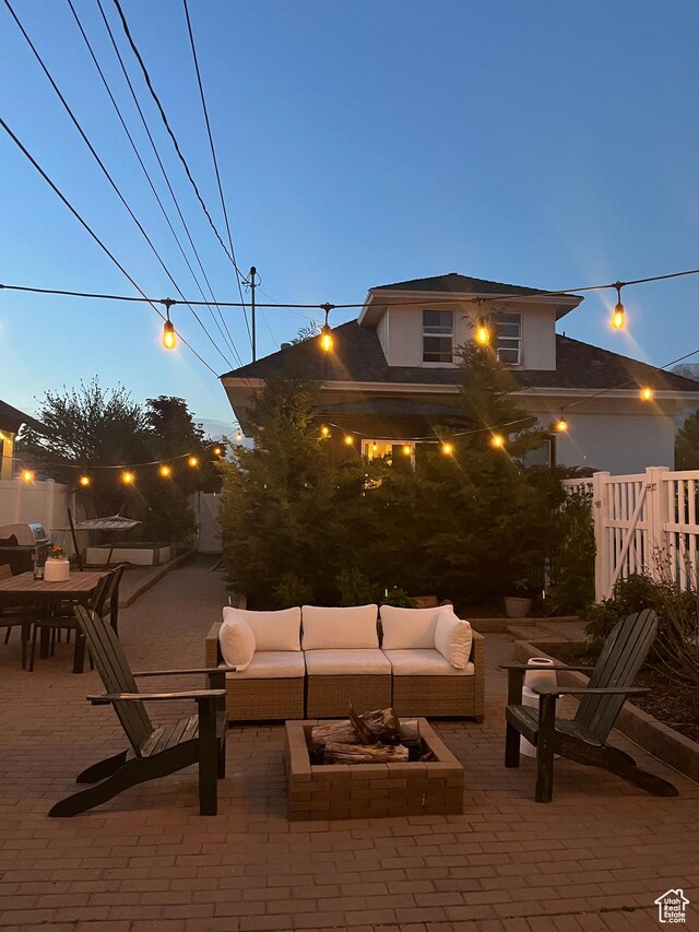 view of patio featuring an outdoor hangout area and fence