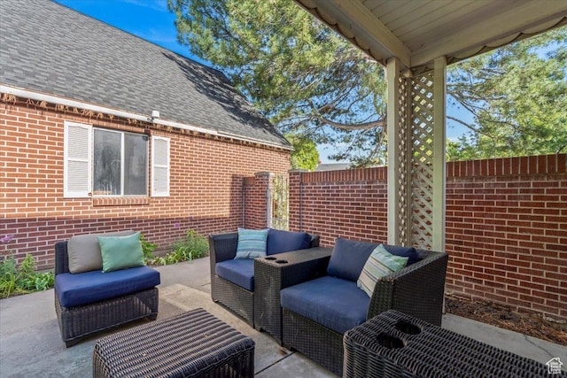 view of patio featuring an outdoor hangout area and fence