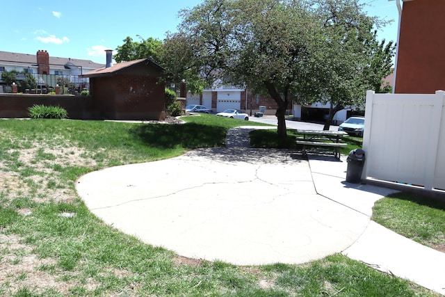 view of green lawn with a residential view