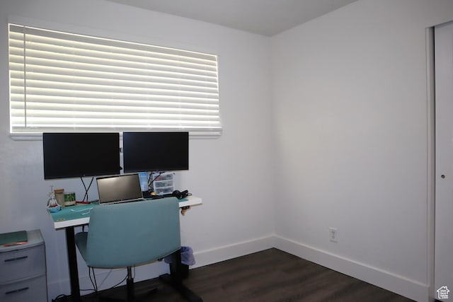 office with dark wood finished floors, baseboards, and plenty of natural light