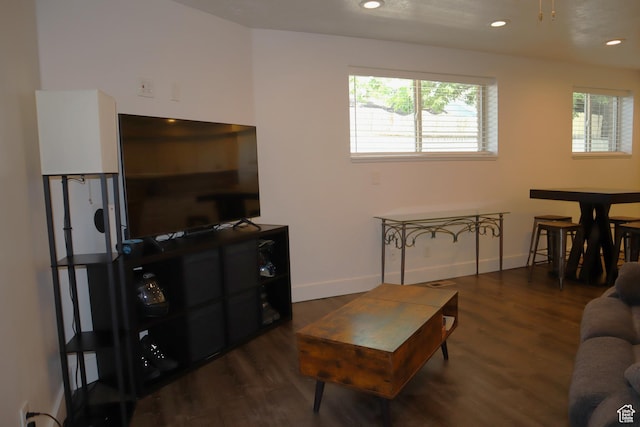 living area with wood finished floors, baseboards, and recessed lighting