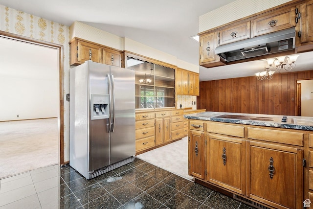 720 N 300 E, Tremonton, UT 84337 - kitchen with stainless steel fridge, electric cooktop, dark colored carpet, a chandelier, and wood walls