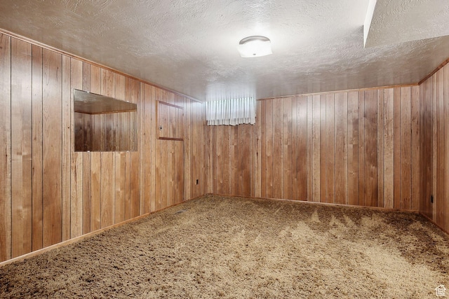720 N 300 E, Tremonton, UT 84337 - carpeted empty room with a textured ceiling and wood walls