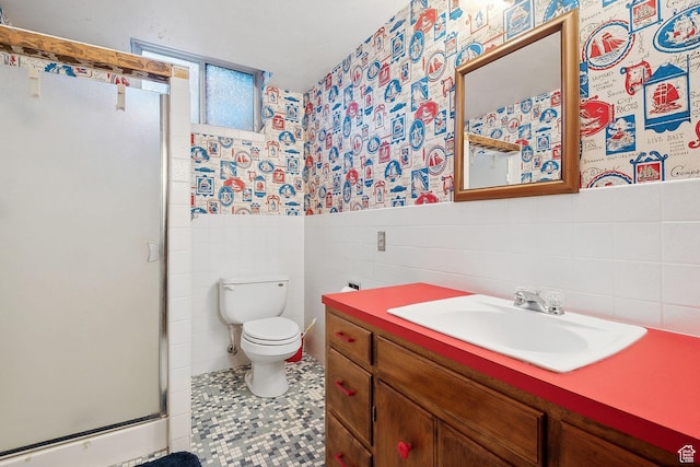 720 N 300 E, Tremonton, UT 84337 - bathroom with tile walls, wallpapered walls, a shower stall, toilet, and wainscoting