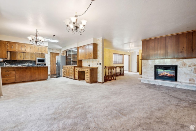 720 N 300 E, Tremonton, UT 84337 - kitchen featuring open floor plan, a chandelier, stainless steel appliances, and light carpet