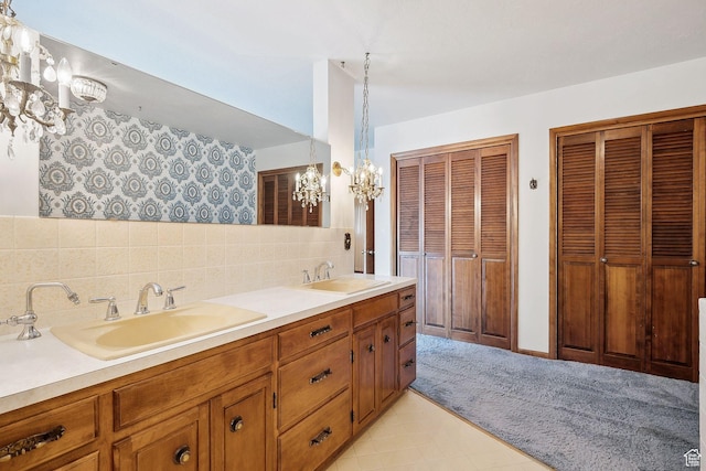 720 N 300 E, Tremonton, UT 84337 - full bathroom featuring a chandelier, backsplash, double vanity, and a closet