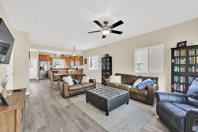 490 E 700 S Unit 514, Clearfield, UT 84015 - living area featuring light wood-style flooring and a ceiling fan