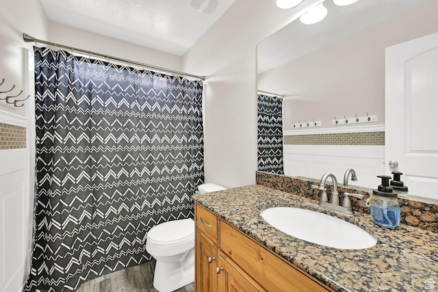 490 E 700 S Unit 514, Clearfield, UT 84015 - bathroom featuring toilet, wood finished floors, vanity, and curtained shower