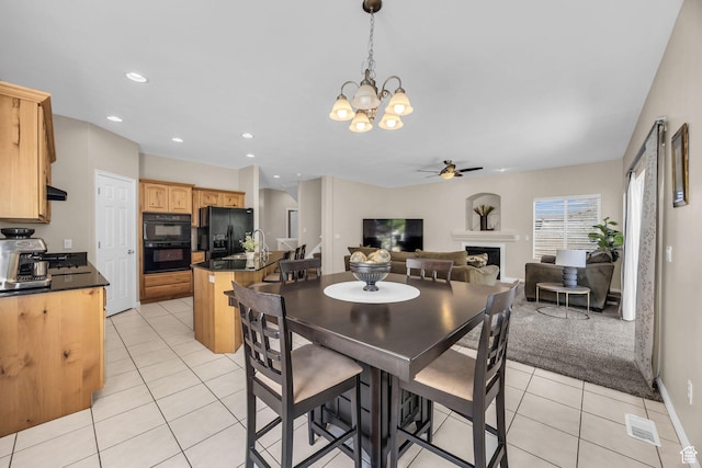 1828 W Woodview Dr, Lehi, UT 84043 - dining space with light tile patterned floors, a ceiling fan, a fireplace, a chandelier, and recessed lighting