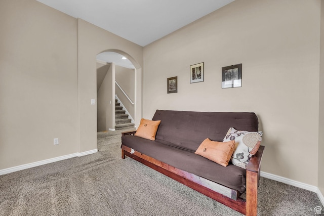 1828 W Woodview Dr, Lehi, UT 84043 - carpeted living room featuring stairs, baseboards, and arched walkways