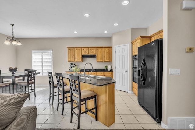 1828 W Woodview Dr, Lehi, UT 84043 - kitchen with black fridge with ice dispenser, under cabinet range hood, a breakfast bar, a sink, and dark countertops