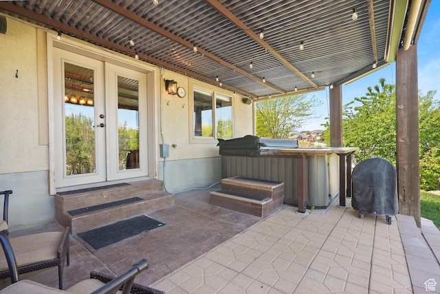 8127 S Bear Lake Ct, West Jordan, UT 84081 - view of patio with a hot tub, french doors, entry steps, and a pergola