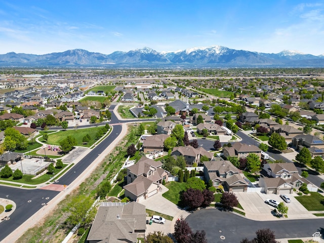 8127 S Bear Lake Ct, West Jordan, UT 84081 - aerial view of property and surrounding area with nearby suburban area and mountains