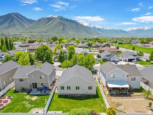 aerial view of residential area featuring a mountainous background