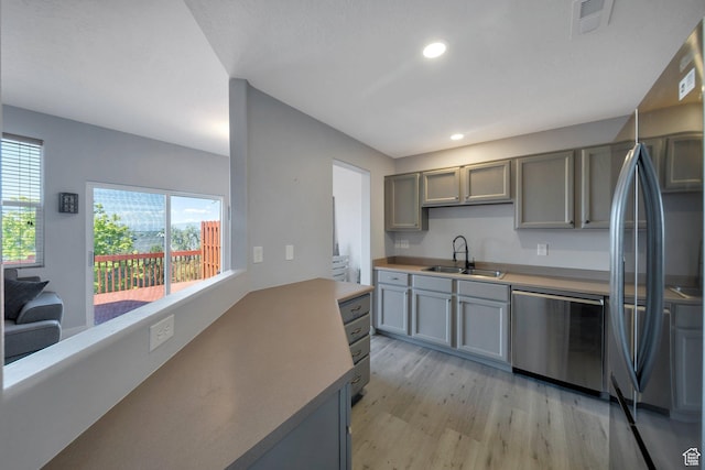175 E Wayfield Dr S, Draper, UT 84020 - kitchen featuring a sink, appliances with stainless steel finishes, light wood-type flooring, recessed lighting, and gray cabinetry