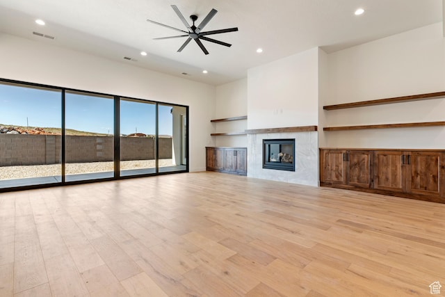 4845 W 2020 S, Hurricane, UT 84737 - unfurnished living room featuring recessed lighting, light wood-style floors, a tile fireplace, and ceiling fan