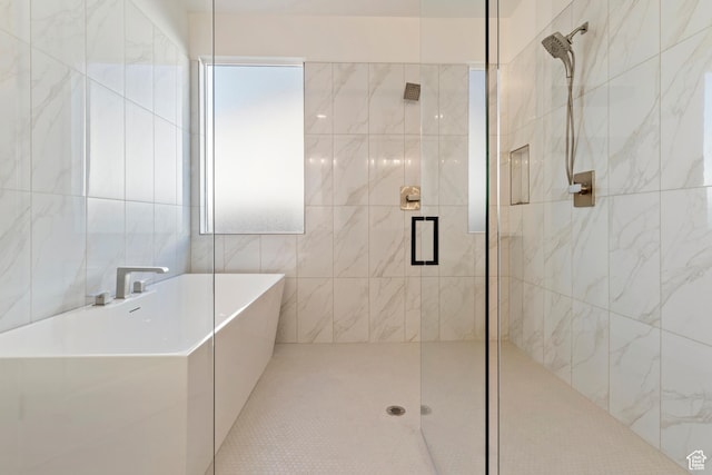 4845 W 2020 S, Hurricane, UT 84737 - bathroom with a shower stall, tile walls, and a soaking tub